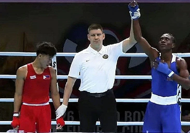 VICTORIOUS: Trinidad and Tobago boxer Makieve “Sniper” Bellille, right, wins his opening fight at the 2026 Under-19 World Boxing Futures Cup in Bangkok, Thailand, in March, defeating Reyjan Palen of the Philippines by a 5–0 score. (Image obtained at trinidadexpress.com)